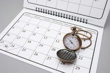 Pocket Watch on Calendar