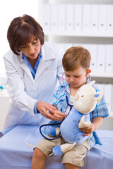 Doctor examining child