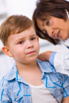 Doctor examining child
