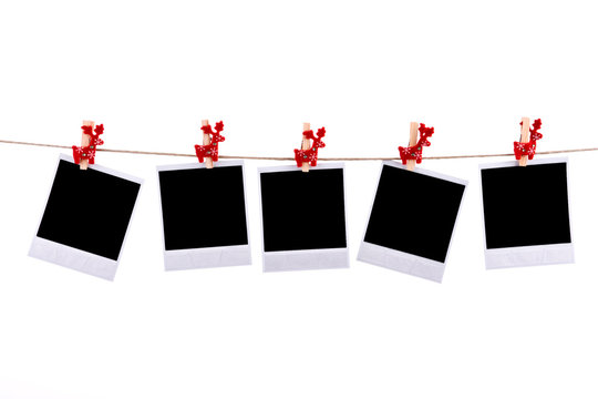 Photos frames with christmas ornaments isolated on white backgro