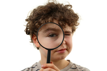 Boy holding magnifying glass