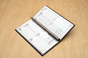 open notebook with pen