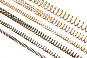 Various metal springs over white