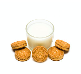 Glass with milk and cakes