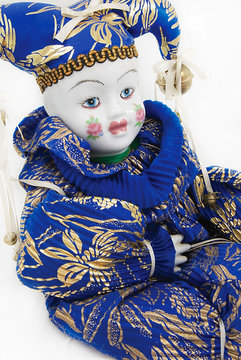 Porcelain doll in blue and gold clothes