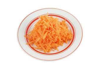 Fresh grated carrot on plate isolated