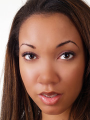 Closeup portrait of young black woman uncertain smile