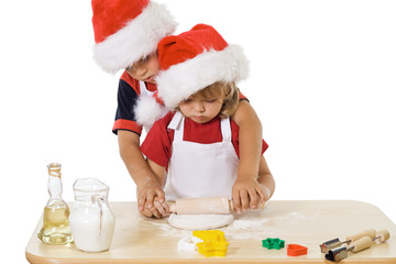 Little boy and girl making christmas cookies