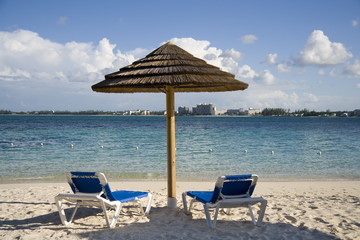 Beach hut and chairs on tropical island