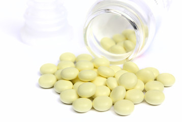 yellow tablets with a jar