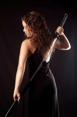 beautiful girl pulls out sword