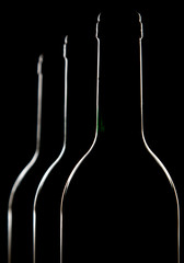 Bottles backlit and isolated on a black background