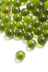 green capsule pills isolated
