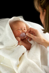 mother taking care of baby