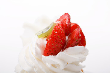 Closeup of cream and strawberries topping