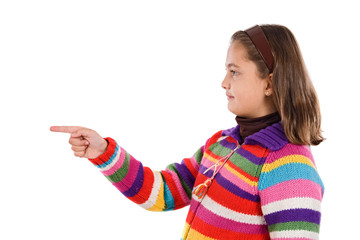 Adorable girl with woollen jacket pointing