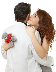 Close-up portrait of attractive couple flirting isolated on whit