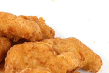 fried chicken nuggest close up on a white background