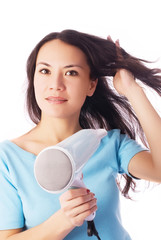 beautiful young woman with a hairdryer