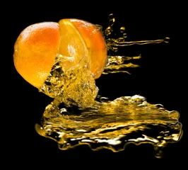 Foto op Canvas Sinaasappel- en sapspatten © Olga Kedrova