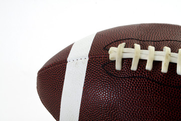 Closeup of a football set against a white background