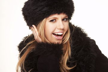 Woman in black fur hat and coat