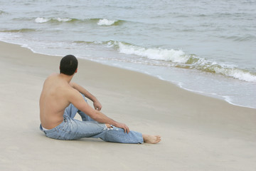 Fototapeta na wymiar man on the beach