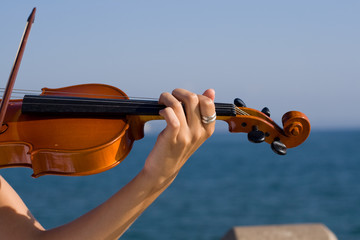 closeup of a woman play violin