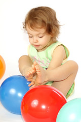 Fototapeta na wymiar Little girl and balloons.