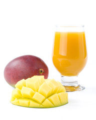 Fresh mango and glass of mango juice