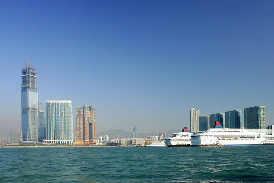 Skyline of modern business district and cruise ship, Hong Kong