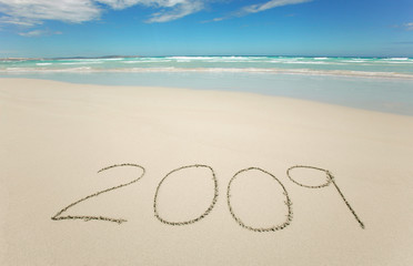 Year 2009 written on tropical beach - obrazy, fototapety, plakaty