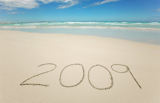 Year 2009 written on tropical beach