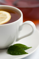 cup of black tea with lemon
