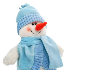 smiling snowman toy dressed in scarf and cap