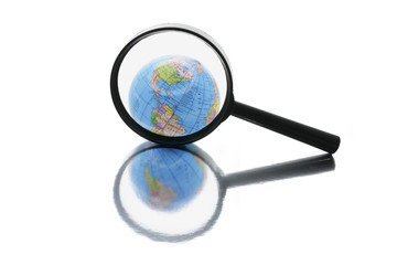 Globe under Magnifying Glass