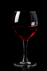 red wine in glass isolated on black background