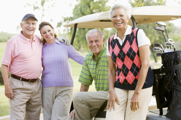 Portrait Of Four Friends Enjoying A Game Golf