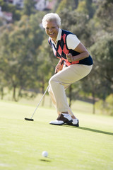 Woman Playing A Game Of Golf