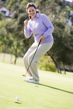 Woman Playing A Game Of Golf