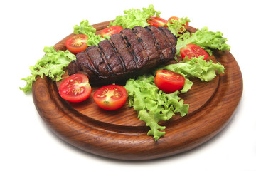 red roast meat served on wooden plate