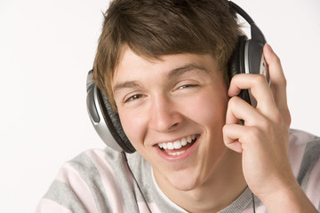 Fototapeta premium Teenage Boy Listening To Music On Headphones