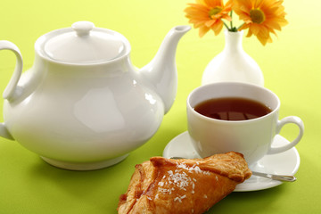Breakfast concept with coffee and croissant