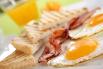 Breakfast - toasts, eggs, bacon