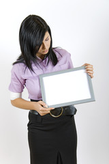 Fototapeta premium business woman holding a blank frame