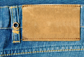 Fragment of jeans with label.