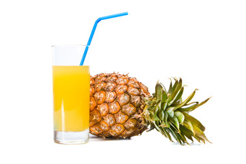 The glass of pineapple juice and ripe pineapple is isolated