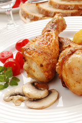 Roasted chicken legs with vegetables