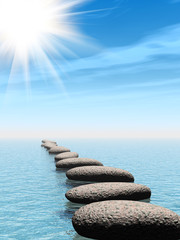 A row of stones in water with sun beam