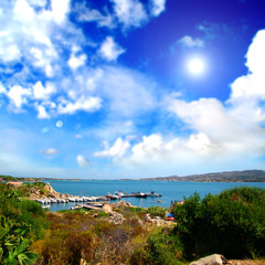 Fototapeta premium Sea landscape with cloudy sky and sun